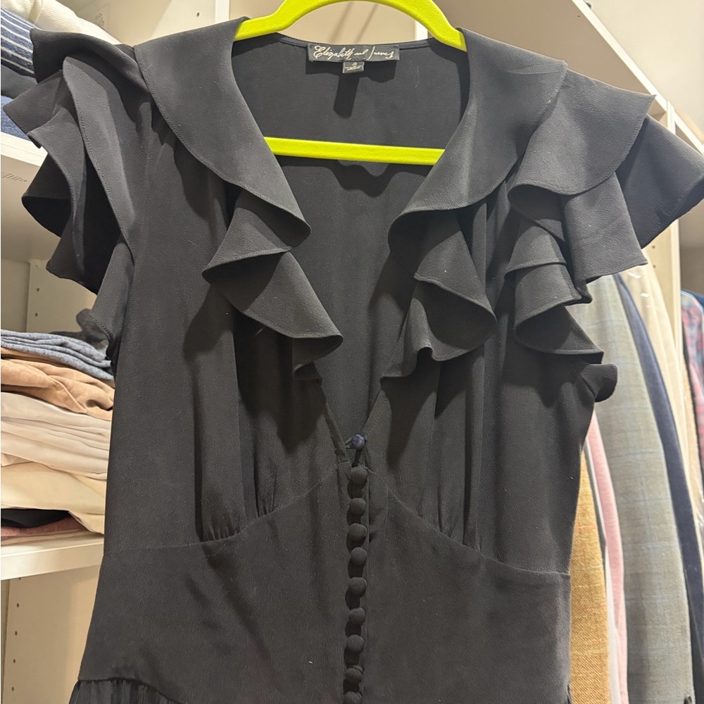 Elizabeth and James Black Silk Ruffled V-Neck Button Front jumpsuit.